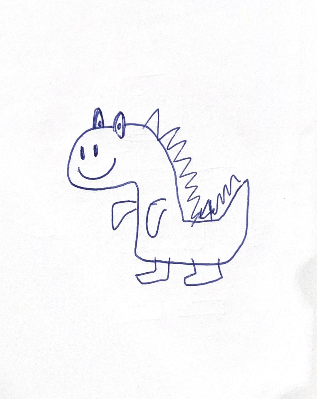 A child's original dinosaur drawing on paper